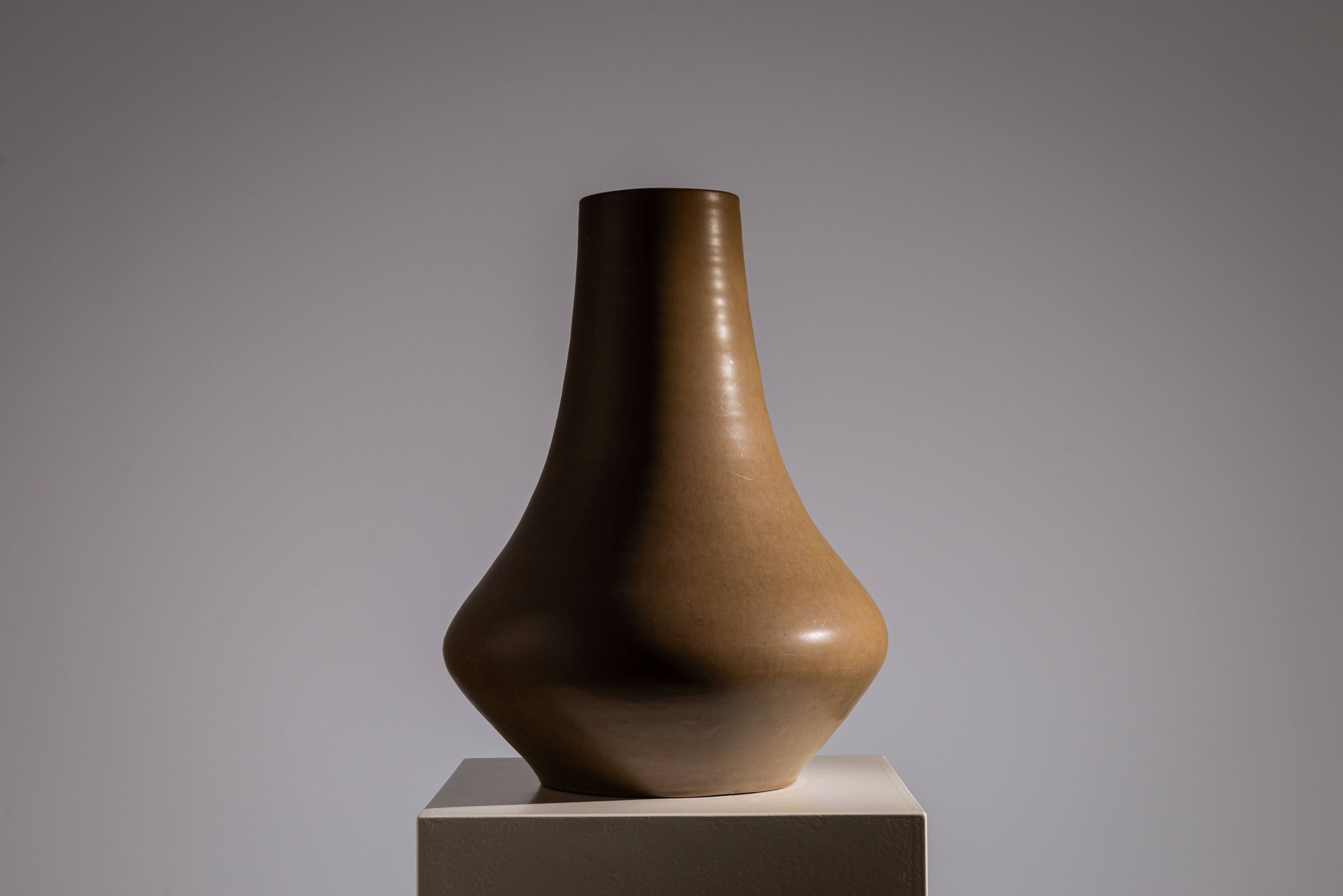 Minimalist curved stoneware vase in matte sand finish