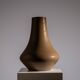 Minimalist curved stoneware vase in matte sand finish