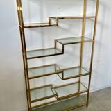 Old shelf in golden metal brass geometric library design 80s vintage