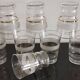 8 glasses with white granite band and gold edging from the 1950s