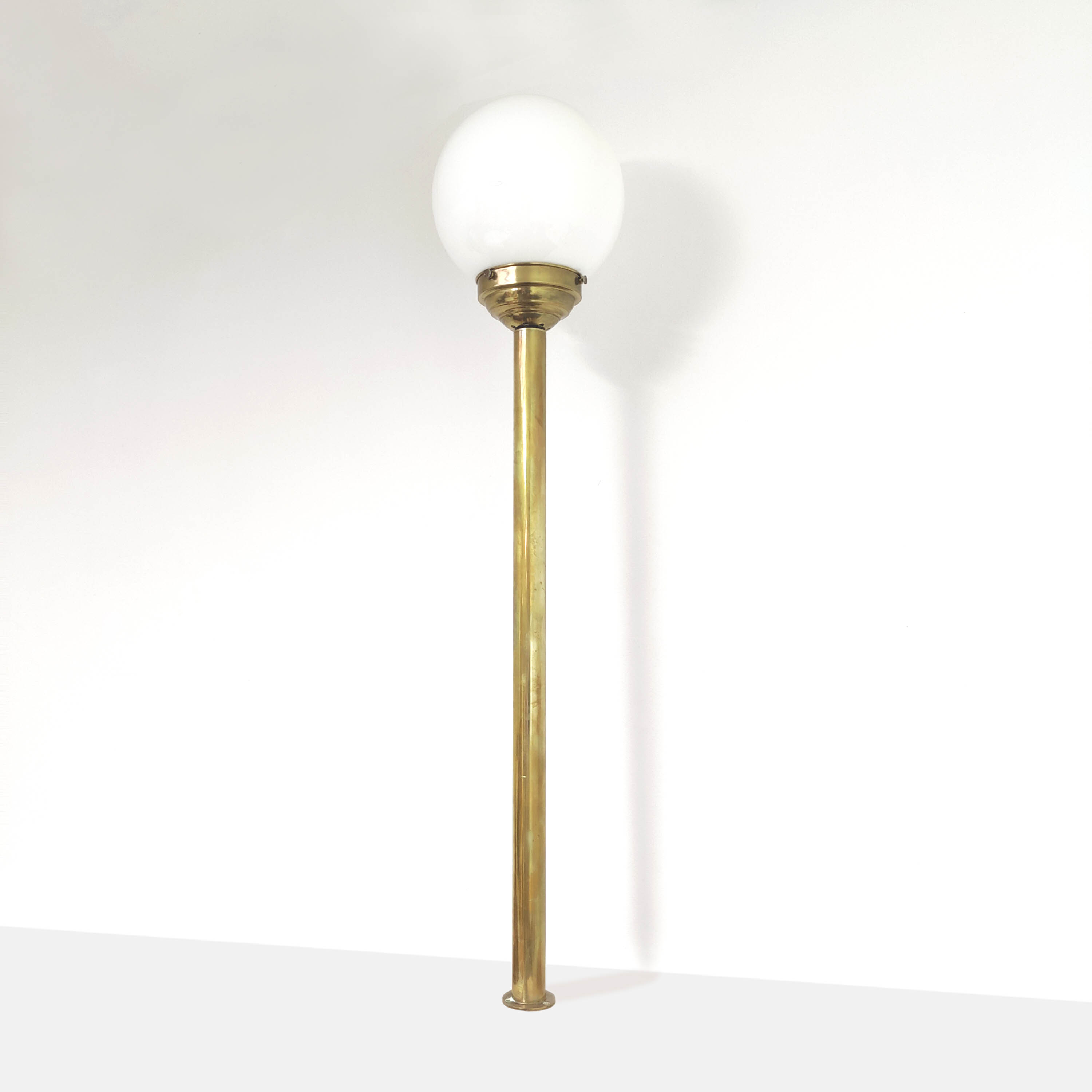 Brass brasserie floor lamp with opaline glass globe