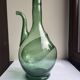 Pair of blown glass wine decanters in blue/green hues.