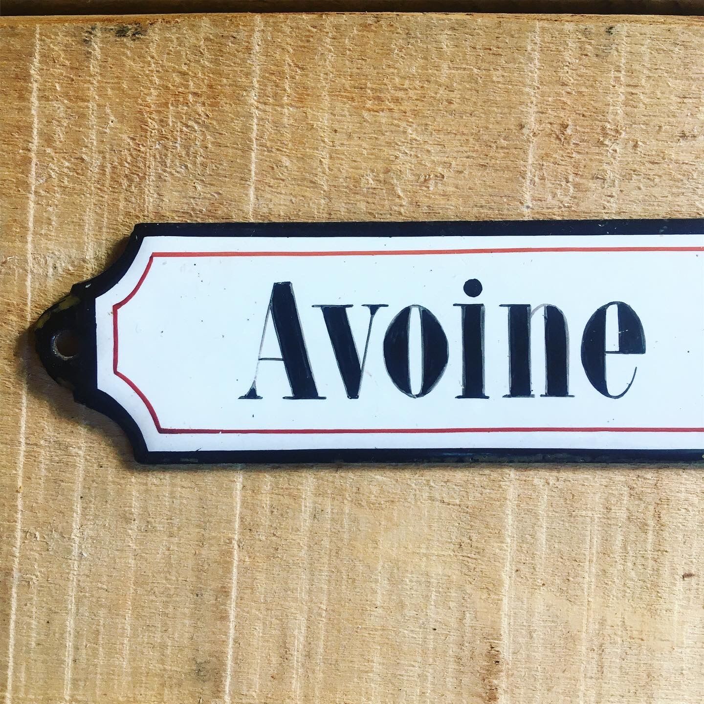 Ancient enamelplate of seed or grocery store. Furniture by trade. 1900s/1910s.