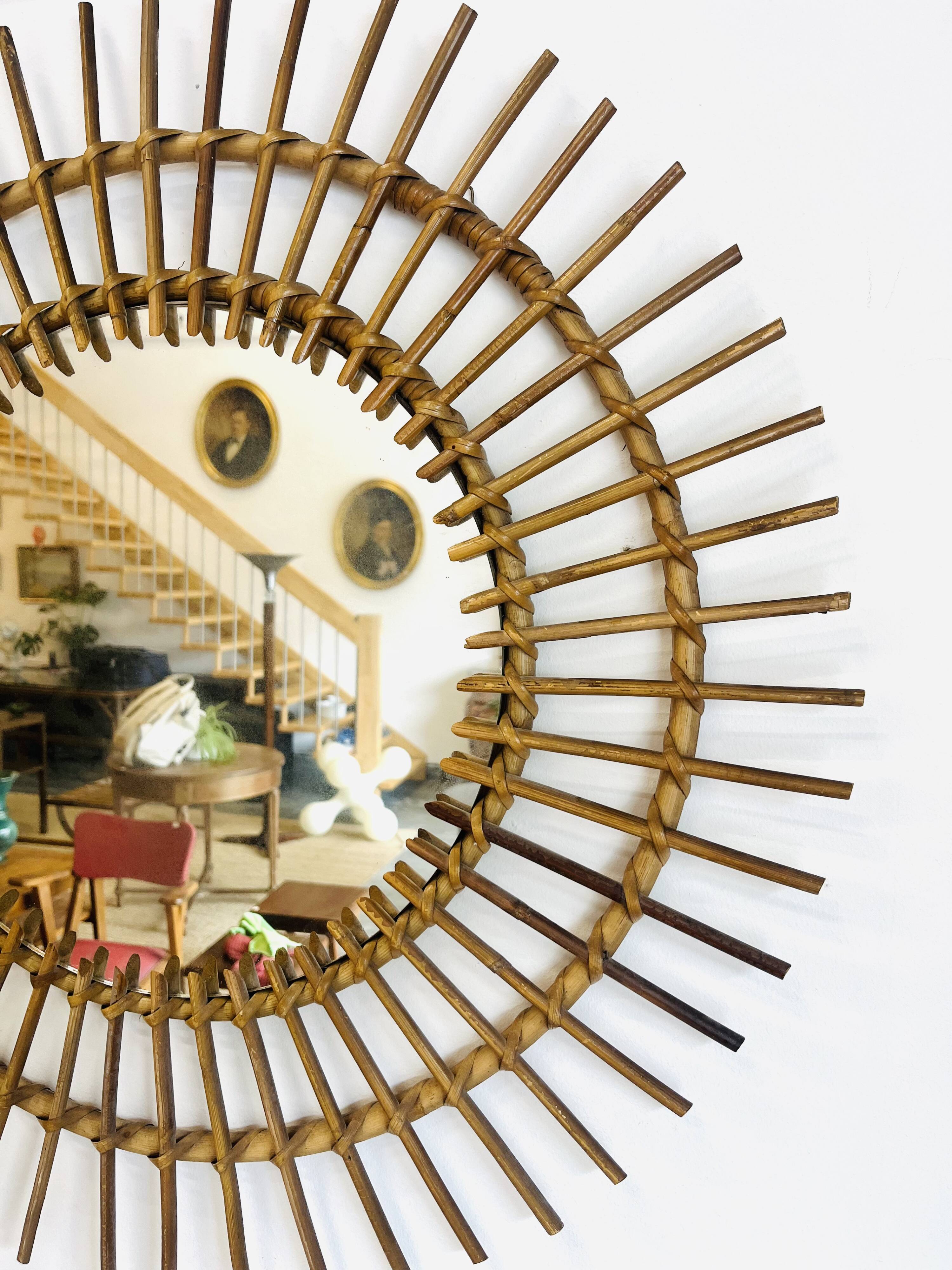 Vintage woven rattan sun mirror from the 60s