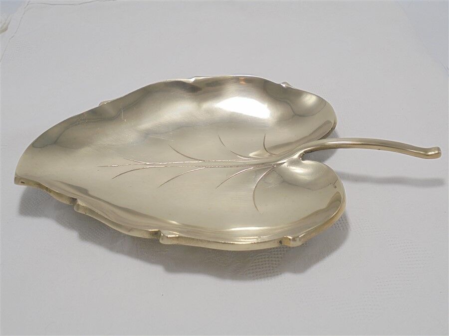 Brass pocket emptier