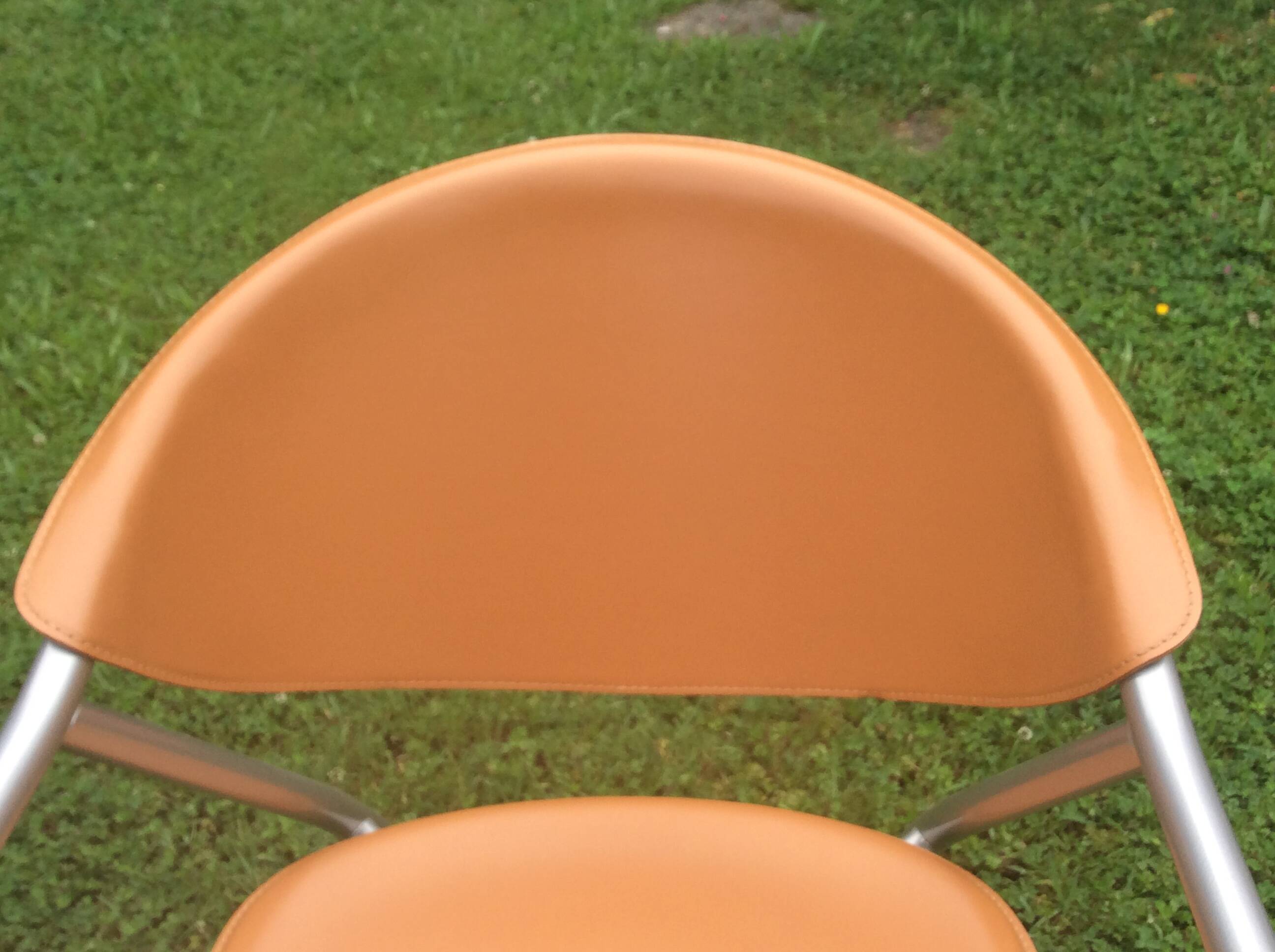 Leather and metal armchairs