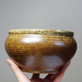 Vintage glazed stoneware bowl or planter in rustic wabi-sabi style.