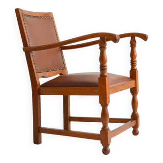 Antique brutalist oak and vinyl armchair