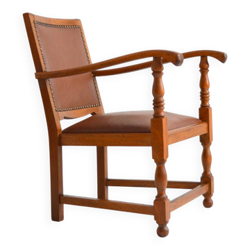 Antique brutalist oak and vinyl armchair
