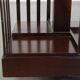 Wooden bookstand with green leather surface and on wheels in English style
