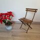 Old folding garden chair for children