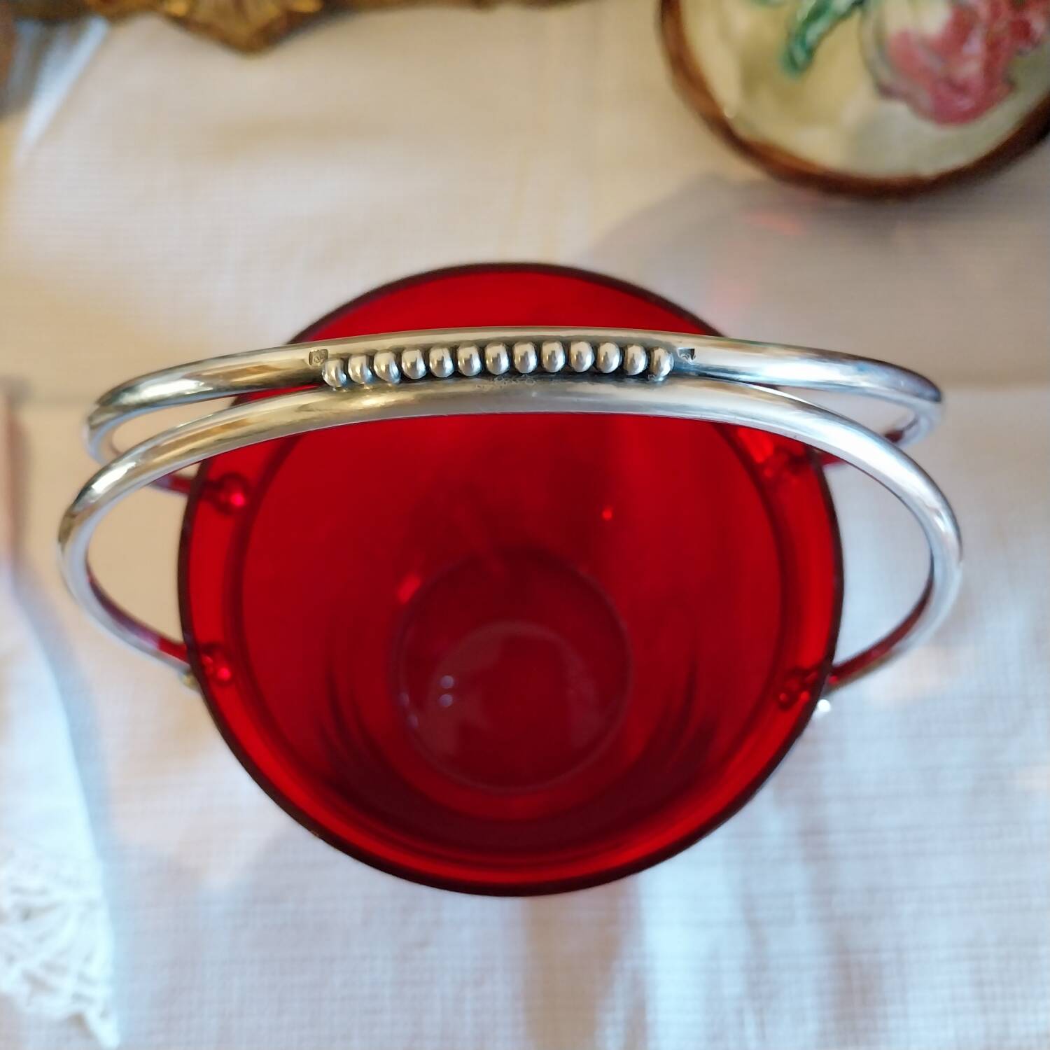 Vintage crystal ice bucket with silver-plated handle.