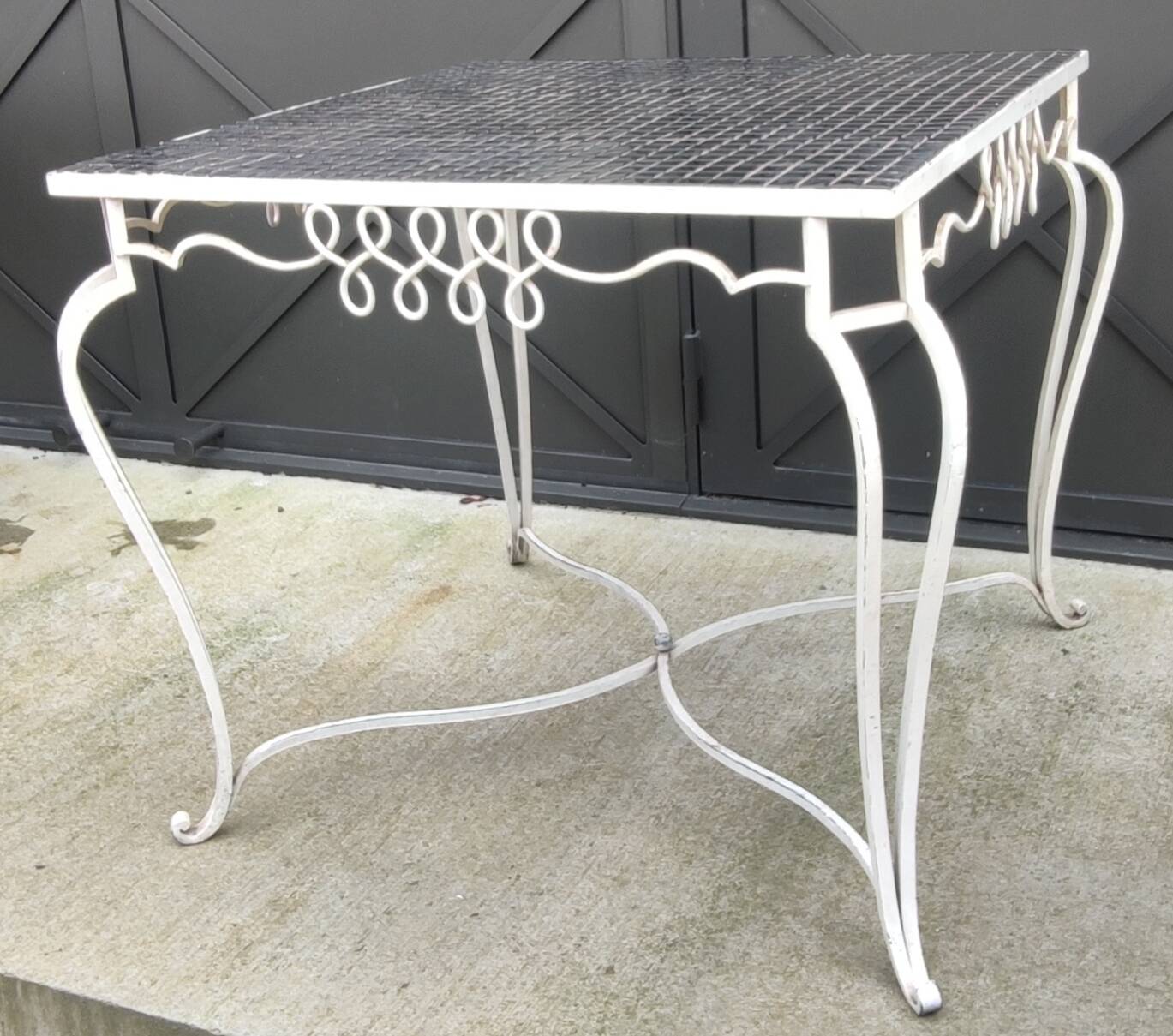 Old wrought iron table / ceramic tile top