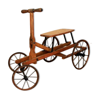 Old wooden child quadricycle tricycle