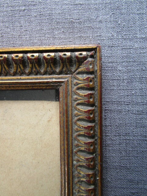 Old frame in worked/golden wood