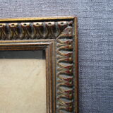 Old frame in worked/golden wood