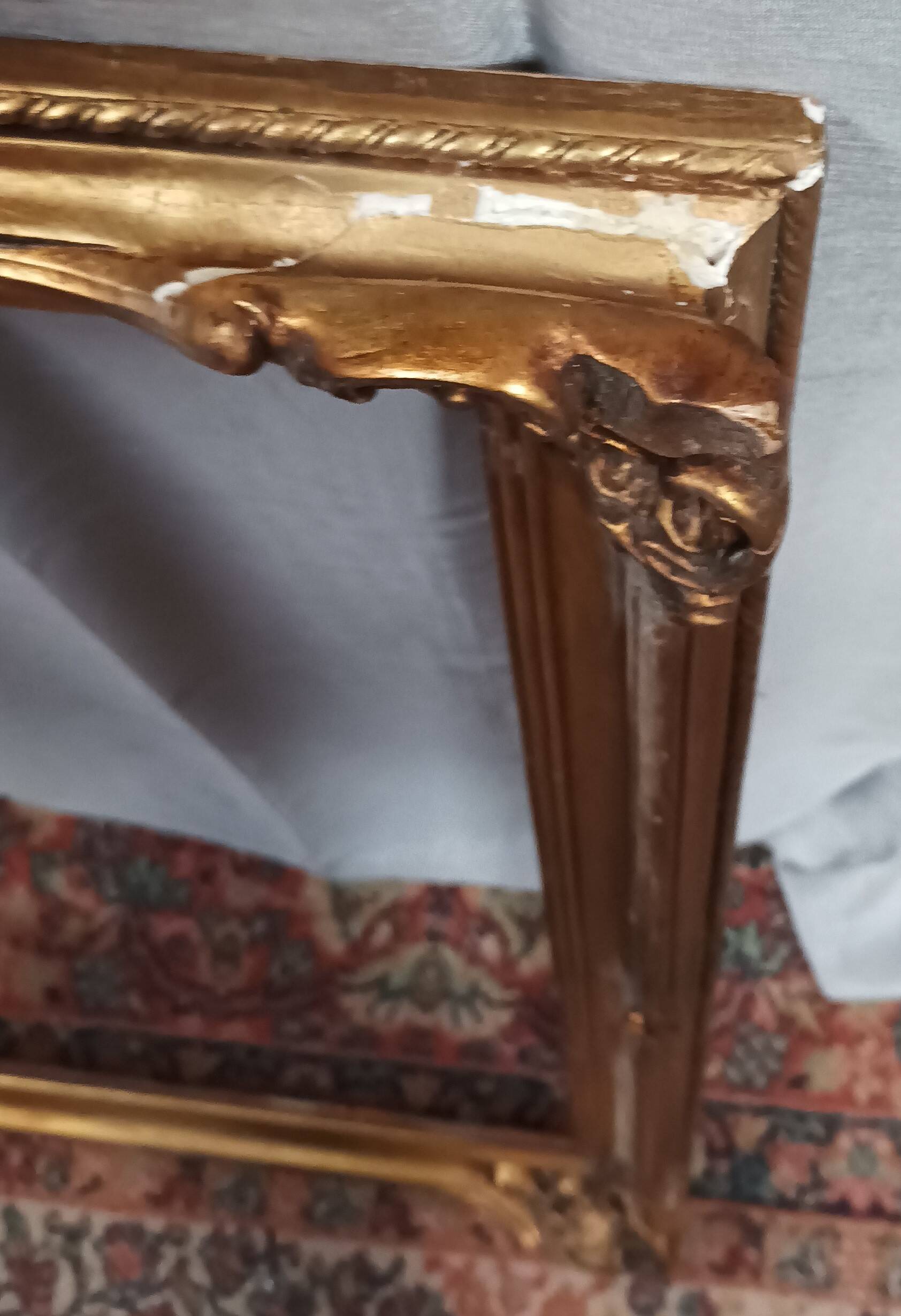 Old frame in wood and gilded stucco