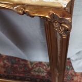 Old frame in wood and gilded stucco