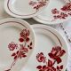 6 vintage dessert plates Moulin des Loups with burgundy floral decoration.
