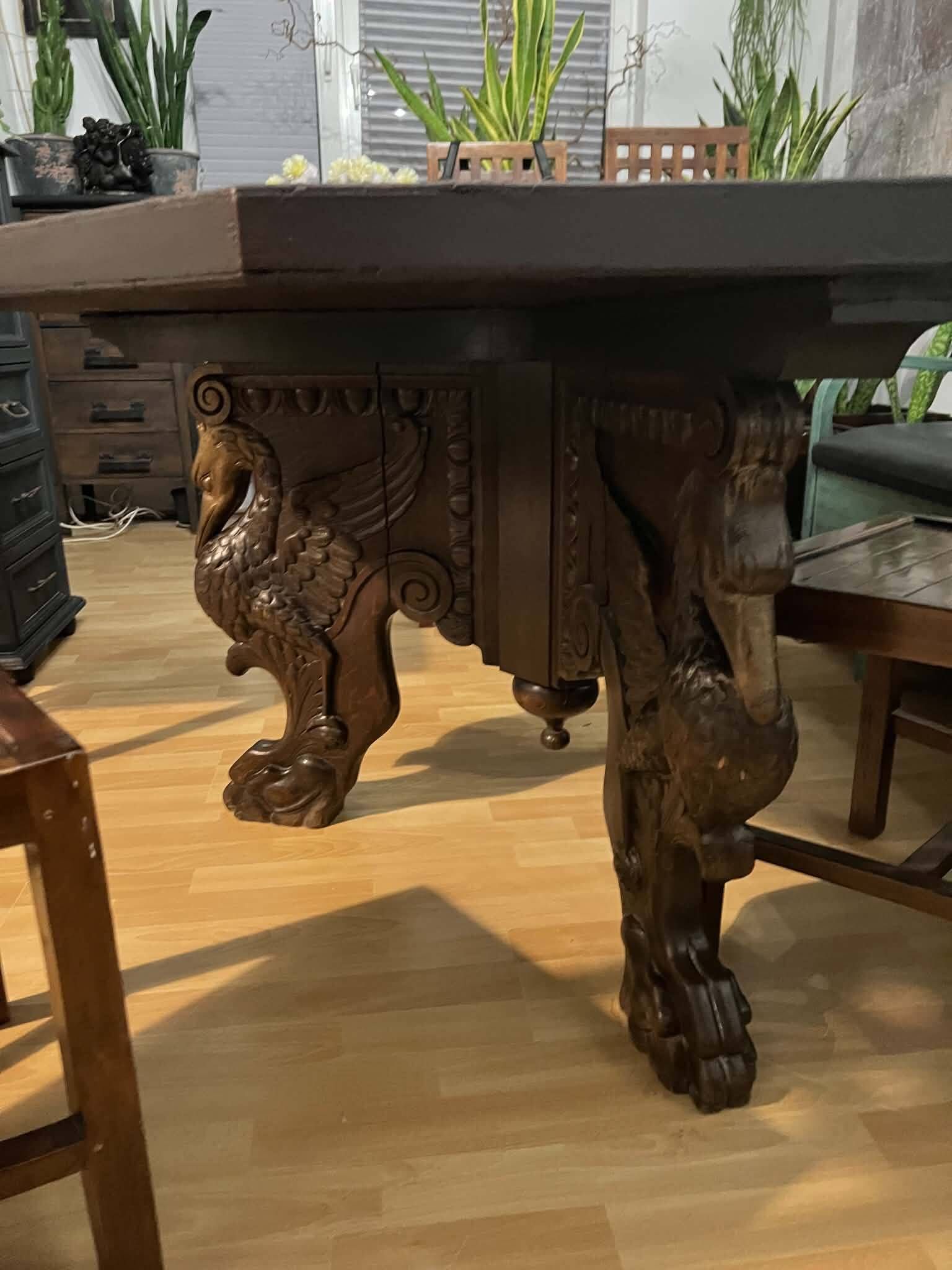 Octagonal oak table, 19th century, with griffins.