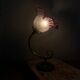 Swan neck wall light in brass with glass tulip.