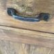 Antique dresser with glass doors and fleur-de-lys from the 50s