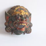 Two polychrome painted and gold leaf gilded Barong dance masks from Bali, Indonesia.