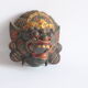 Two polychrome painted and gold leaf gilded Barong dance masks from Bali, Indonesia.