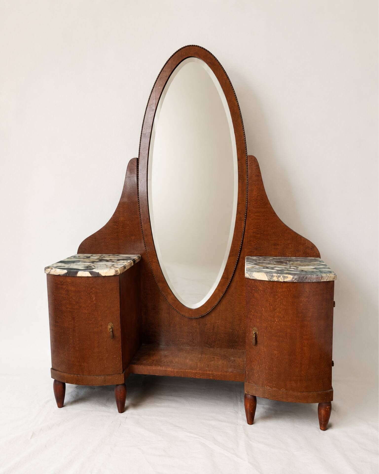 Art Deco dressing table in wood and marble, large oval mirror, 1930s-40s.
