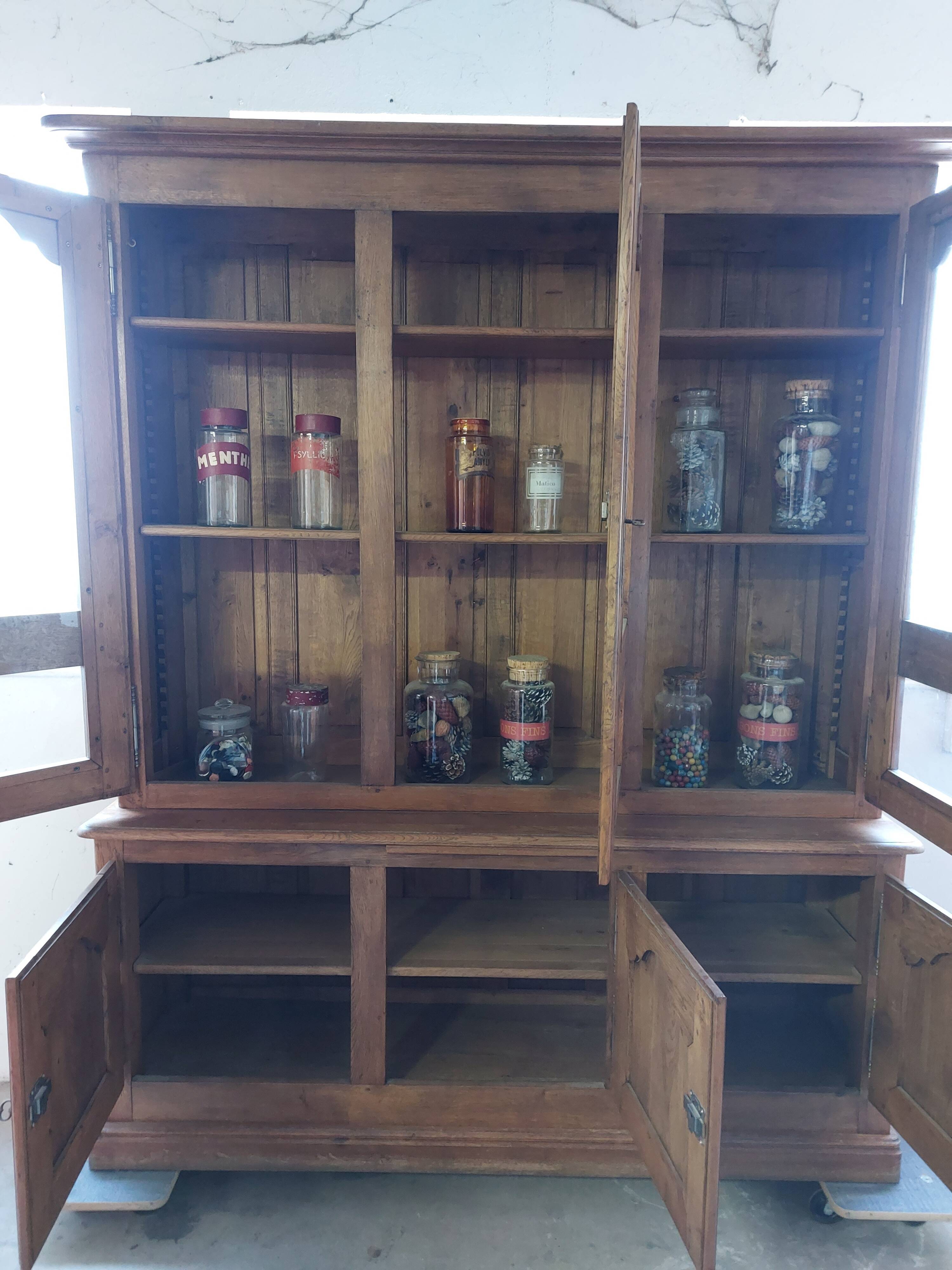 Showcase library with two sections in solid oak.