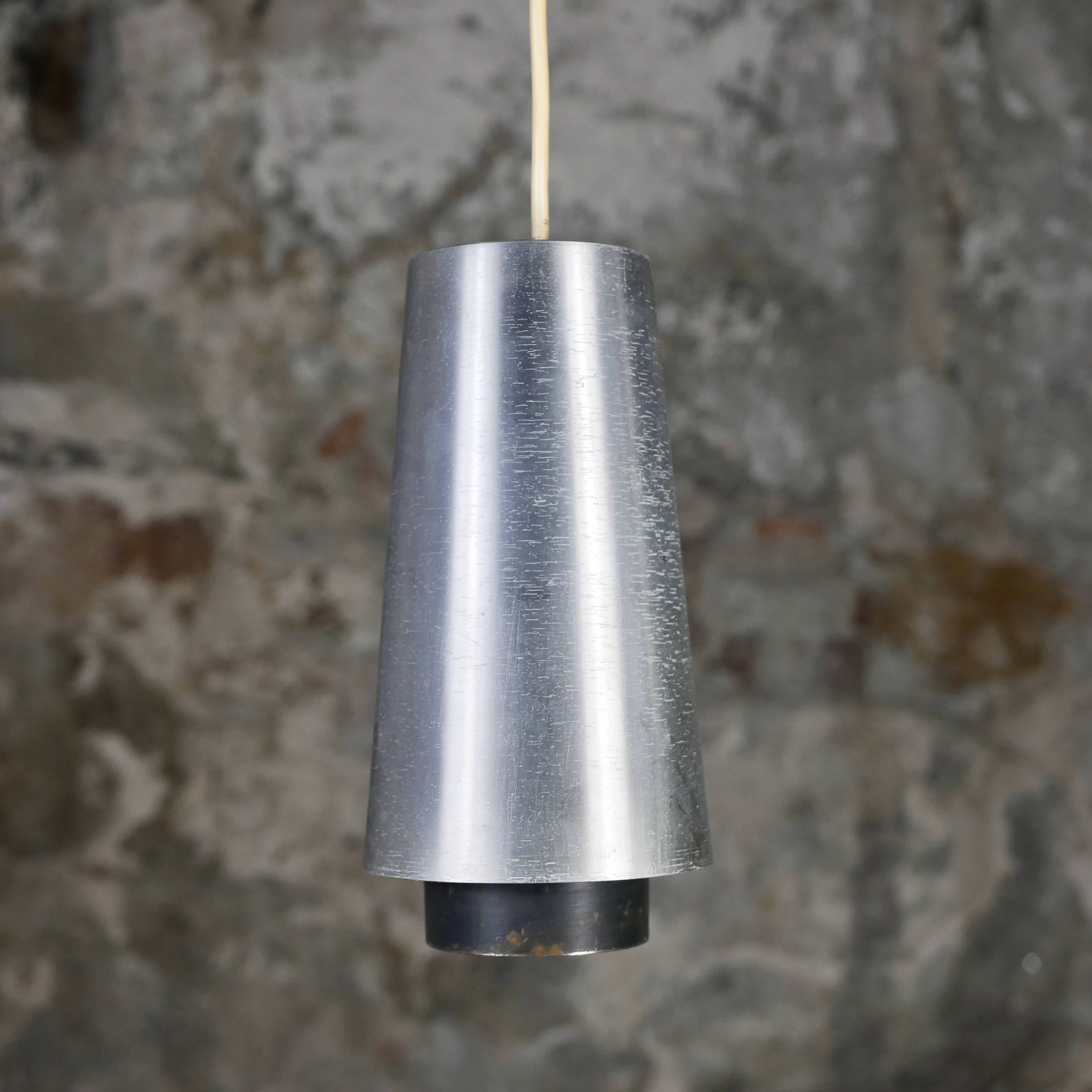 Trio of Raak steel pendant lights, 1960s