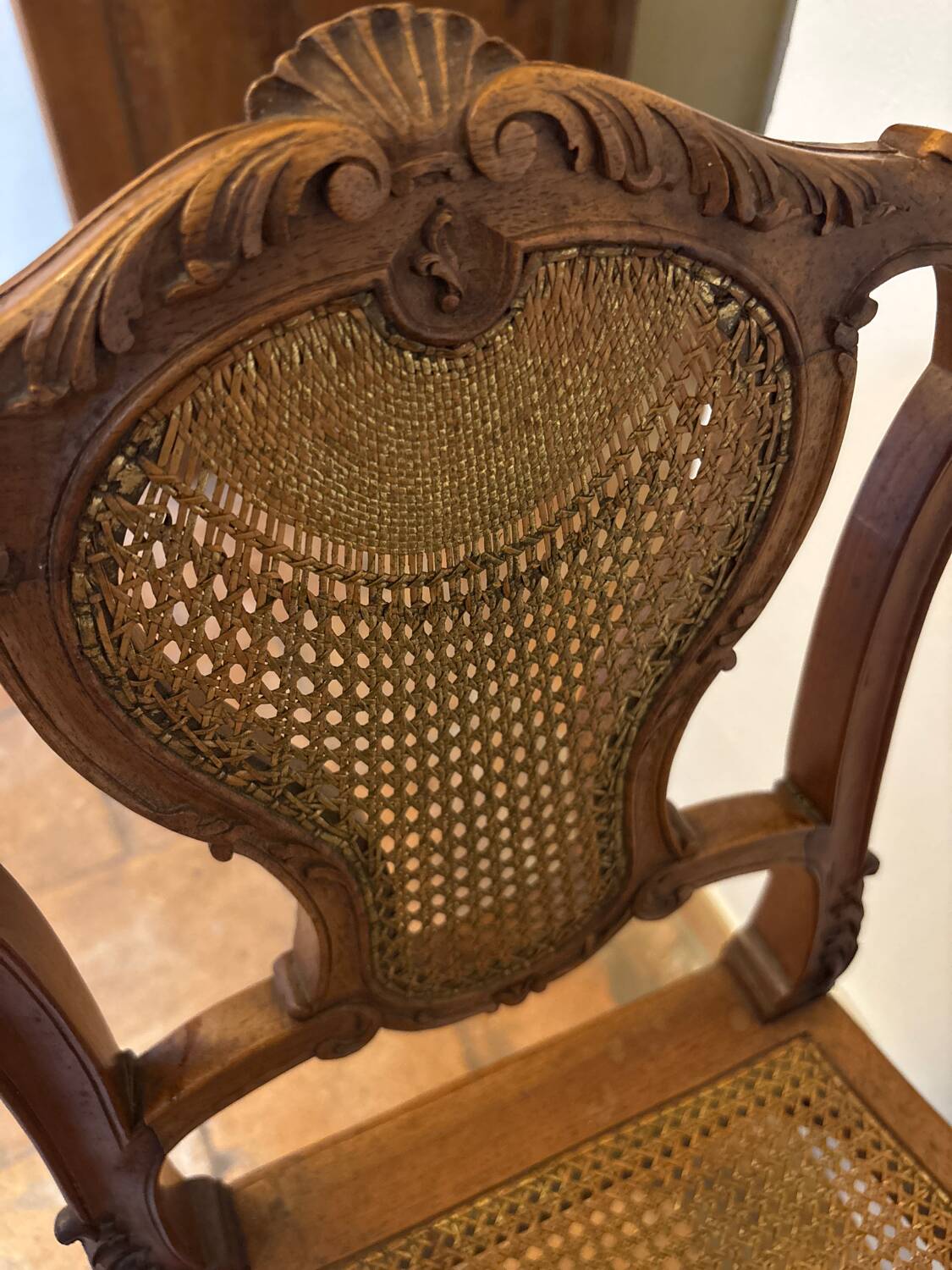 Pair of Louis XV style chairs in wood and caning.