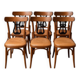 Set of 6 vintage curved wooden chairs, adorned with an elegant black lyre-shaped backrest.