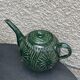 Service to the ceramic enamelled chiseled green and vintage
