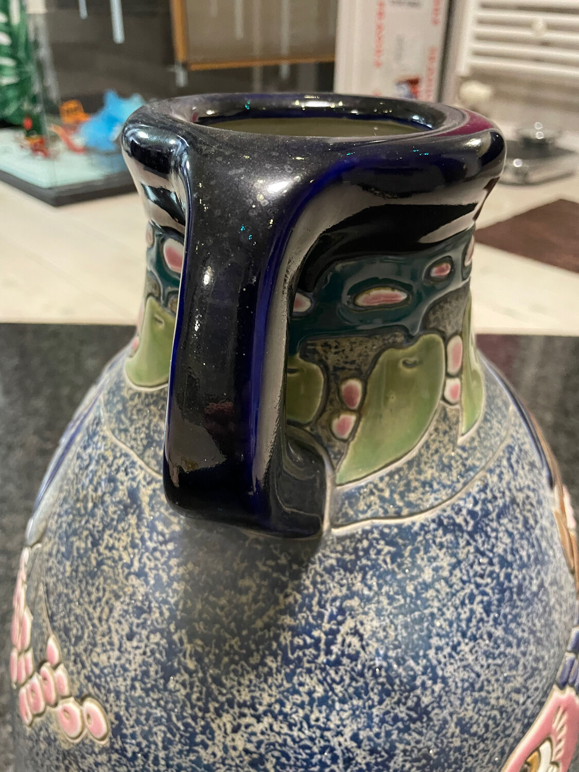 Large relief vase with parrot design