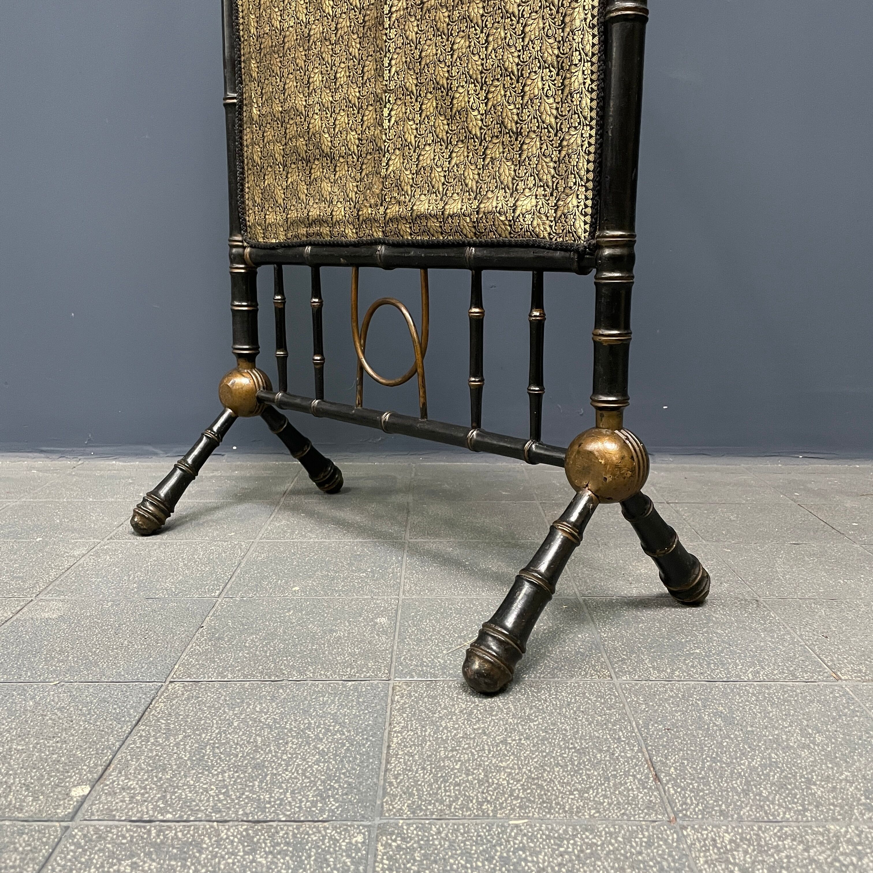 Antique black and gold faux bamboo fireplace screen