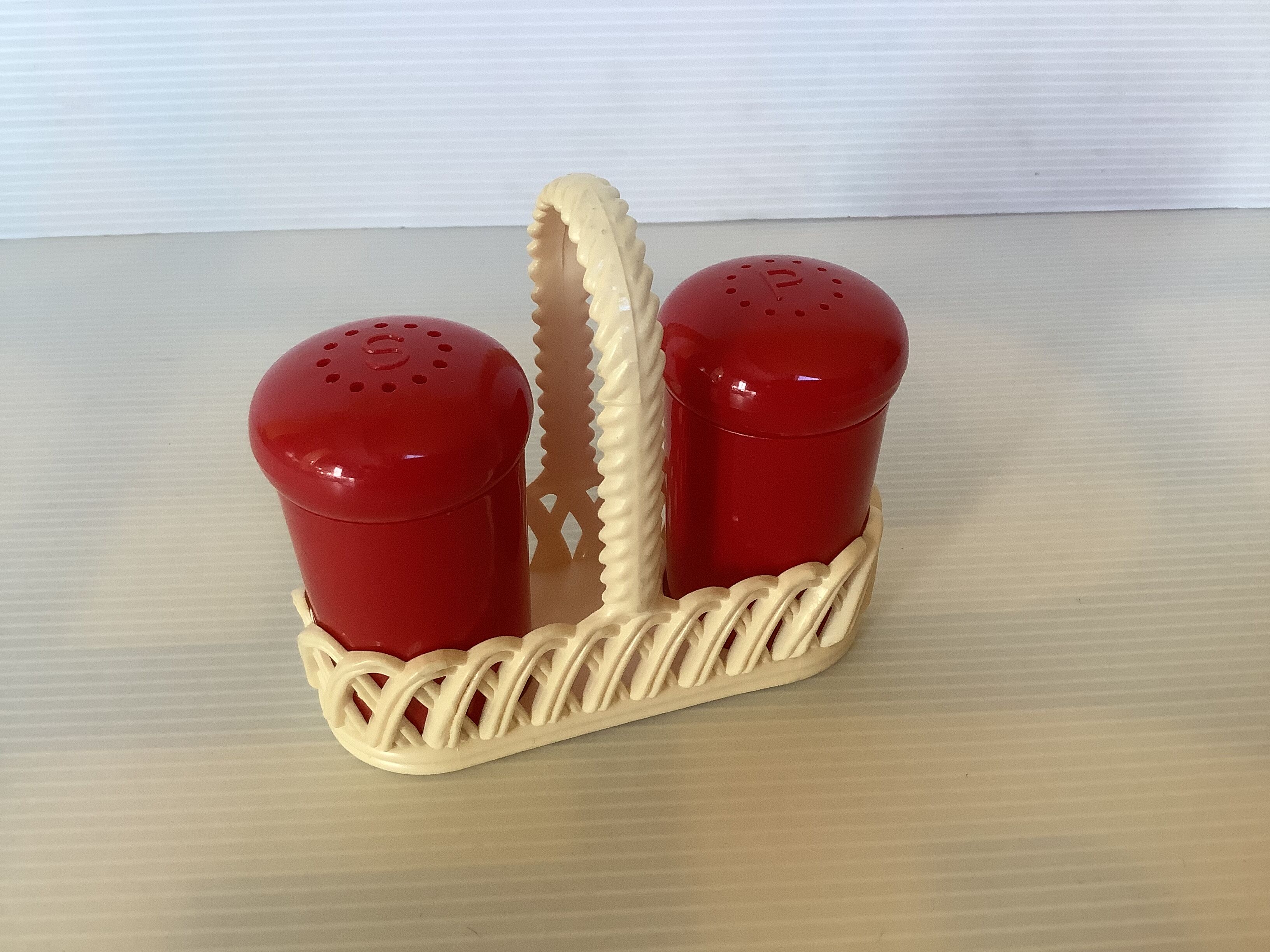 Red and white plastic salt and pepper shakers Emsa.