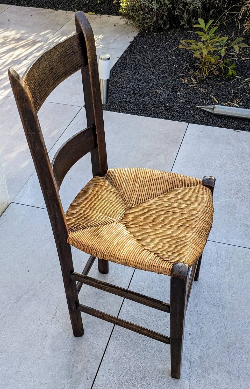 4 mismatched wood and straw chairs
