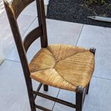 4 mismatched wood and straw chairs