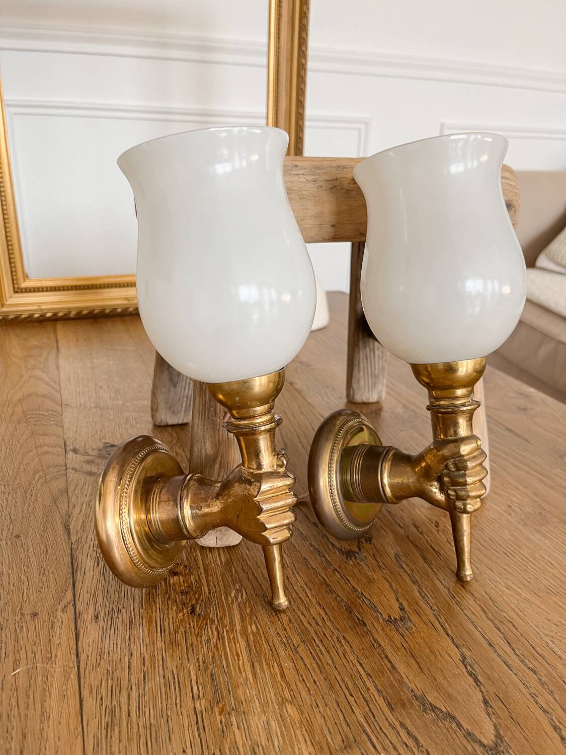 Set of 2 golden, bronze and brass torch wall lights