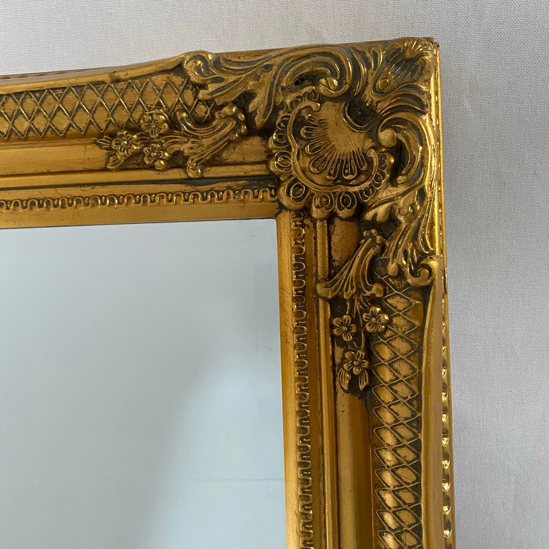 Bevelled mirror, golden empire style 74x64cm