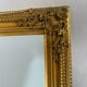 Miroir biseauté style empire doré 74x64cm