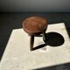 Low flat tripod stool in upcycled teak - Small tripod stool in solid brown wood with a circular seat.