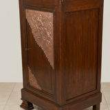 Small storage unit in solid wood and copper.