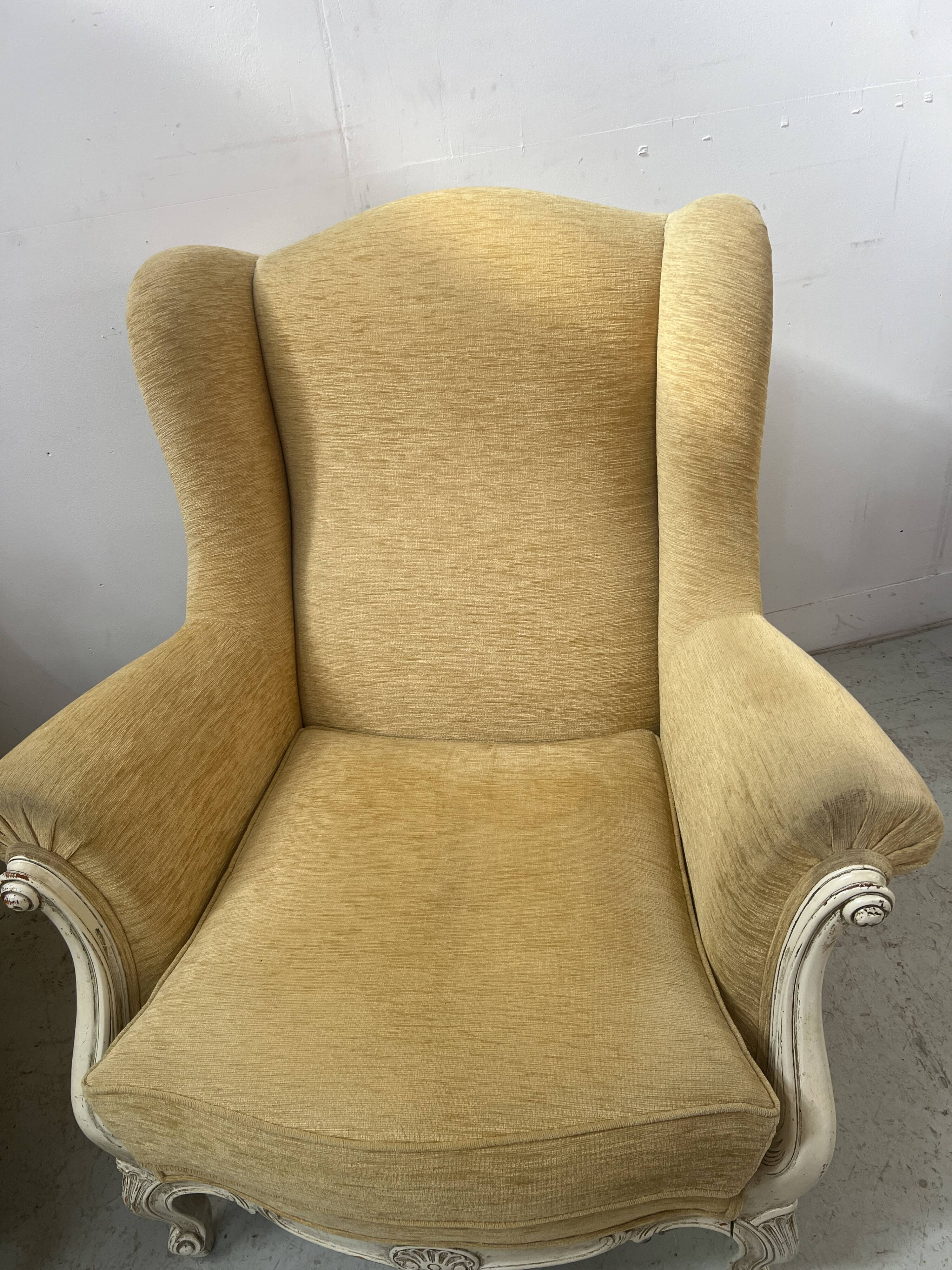 Pair of Louis XV style wing chairs in patinated beech, 20th century