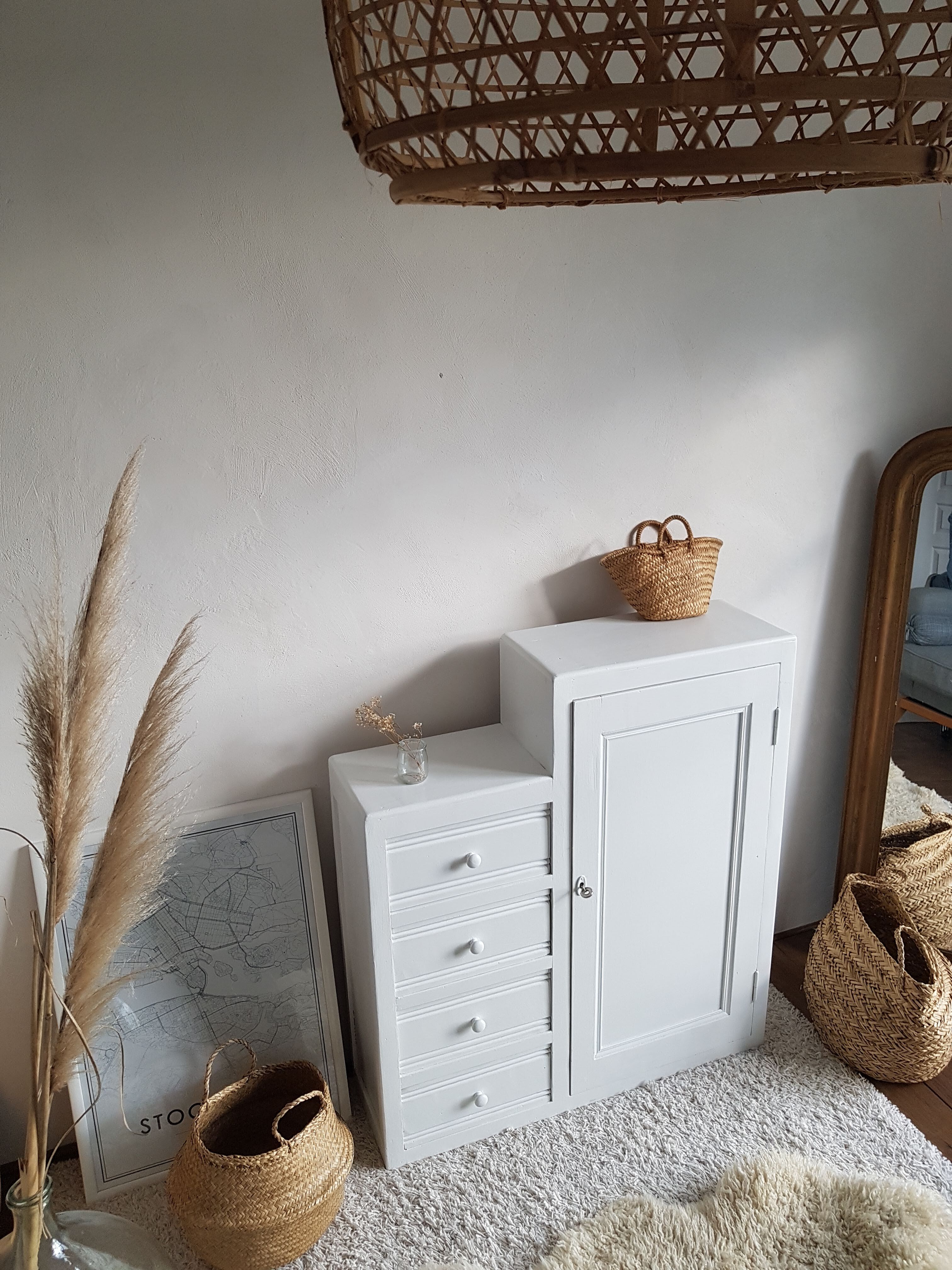 Old white asymmetrical chest of drawers