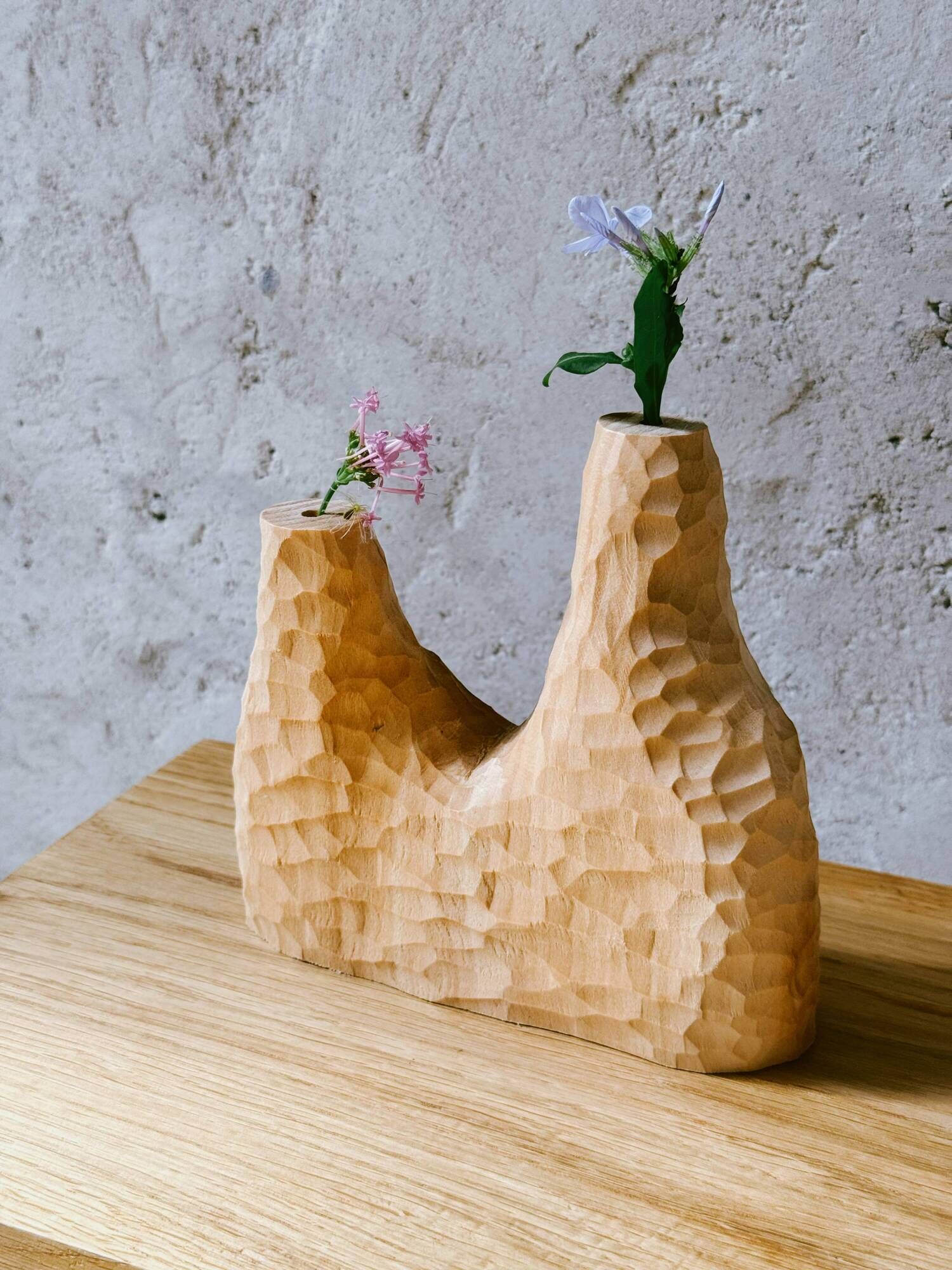 Hand-carved soliflore vase in solid lime wood.