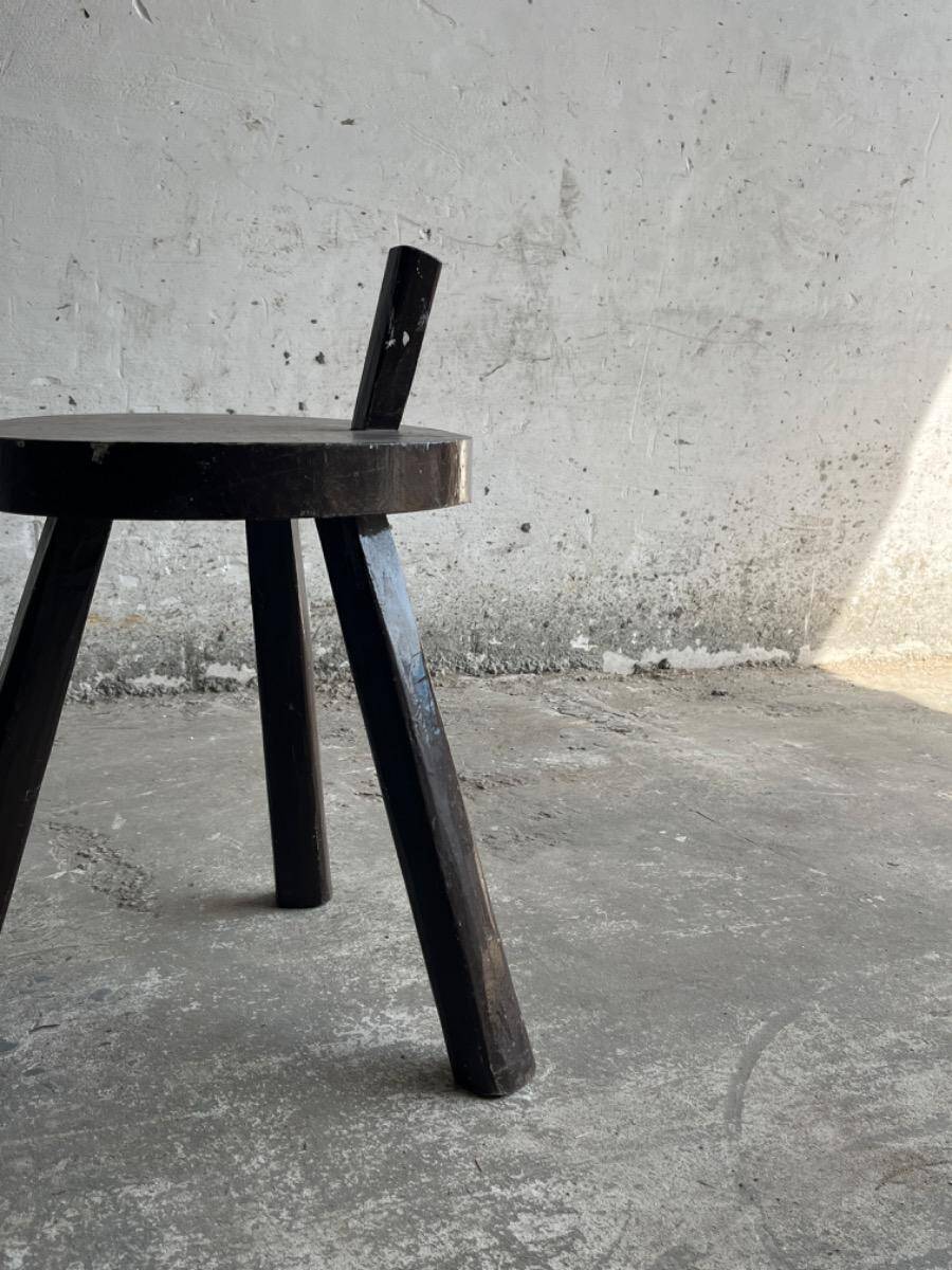 Black solid wood vintage tripod stool with angled back peg — France, 1960s