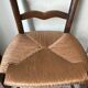 Wooden and straw chairs