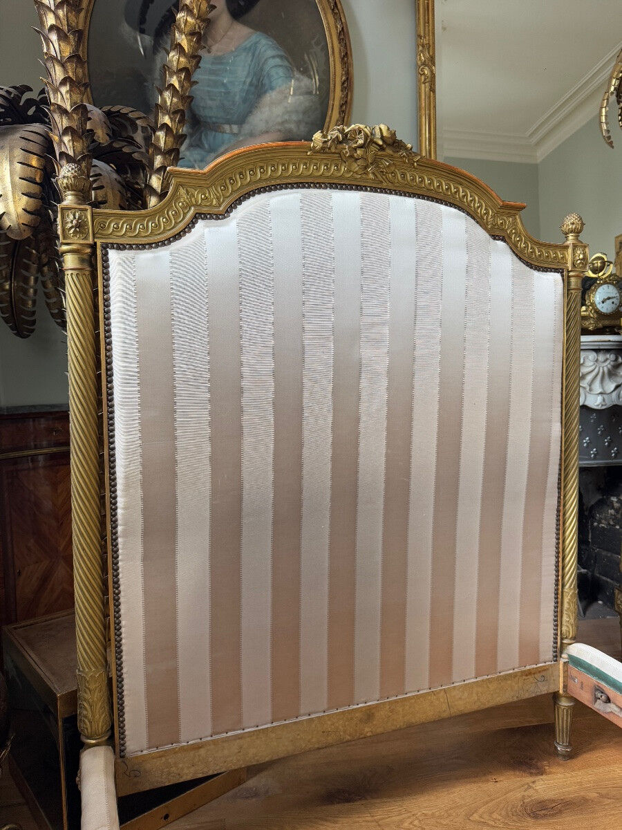 Pair of late 19th-century gilded wooden beds in Louis XVI style.